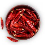 Red Chili Pepper In A Wooden Bowl Isolated On White Background